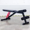 Vitox Fitness - Adjustable FID bench VB115, with a padded seat and backrest, shown in multiple positions (flat, incline, decline), with leg holder foam. Features a sturdy frame and adjustable settings for versatile workouts.