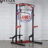 Vitox Fitness Half rack VR220: A compact weightlifting structure with two vertical posts and adjustable barbell hooks. It provides support for exercises like squats and bench presses while taking up less space than a full power rack. It includes safety arms, a multi-grip pull-up bar, and four weight plate storage and two bar storage tube. Optional attachment for added versatility, such as Lat/Row Pulley, Dip Handle, AB Board, Wrist Trainer and T-Bar Training.