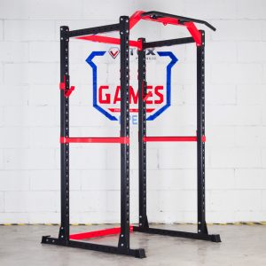 Vitox Fitness Power Rack VR225: A sturdy, rectangular metal frame designed for weightlifting exercises. It features adjustable safety bars and hooks to hold a barbell, allowing for safe squats, bench presses, and other strength training movements. The structure has multiple height settings and multi grip pull-ups and optional lat/row pulley attachment.