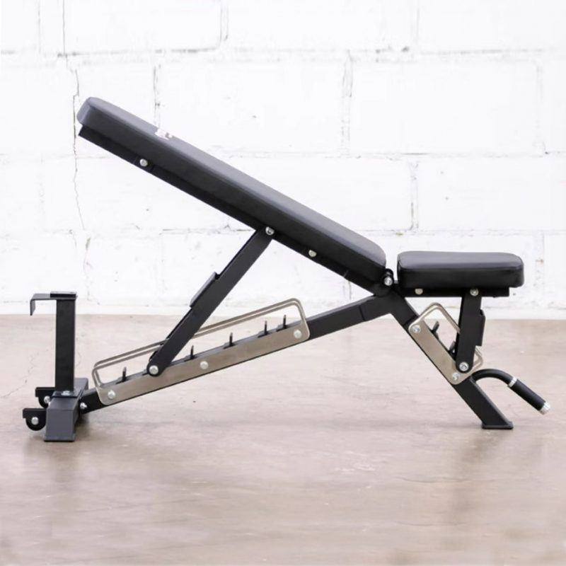 Vitox Fitness-Adjustable commercial utility bench VB177 with black padding and a sturdy steel frame. The bench features an adjustable backrest and seat, allowing for various incline, flat, and decline positions. Designed for heavy-duty use in commercial gyms or home settings, this bench is ideal for strength training exercises like presses and rows. The compact design includes a handle and wheels for easy mobility.